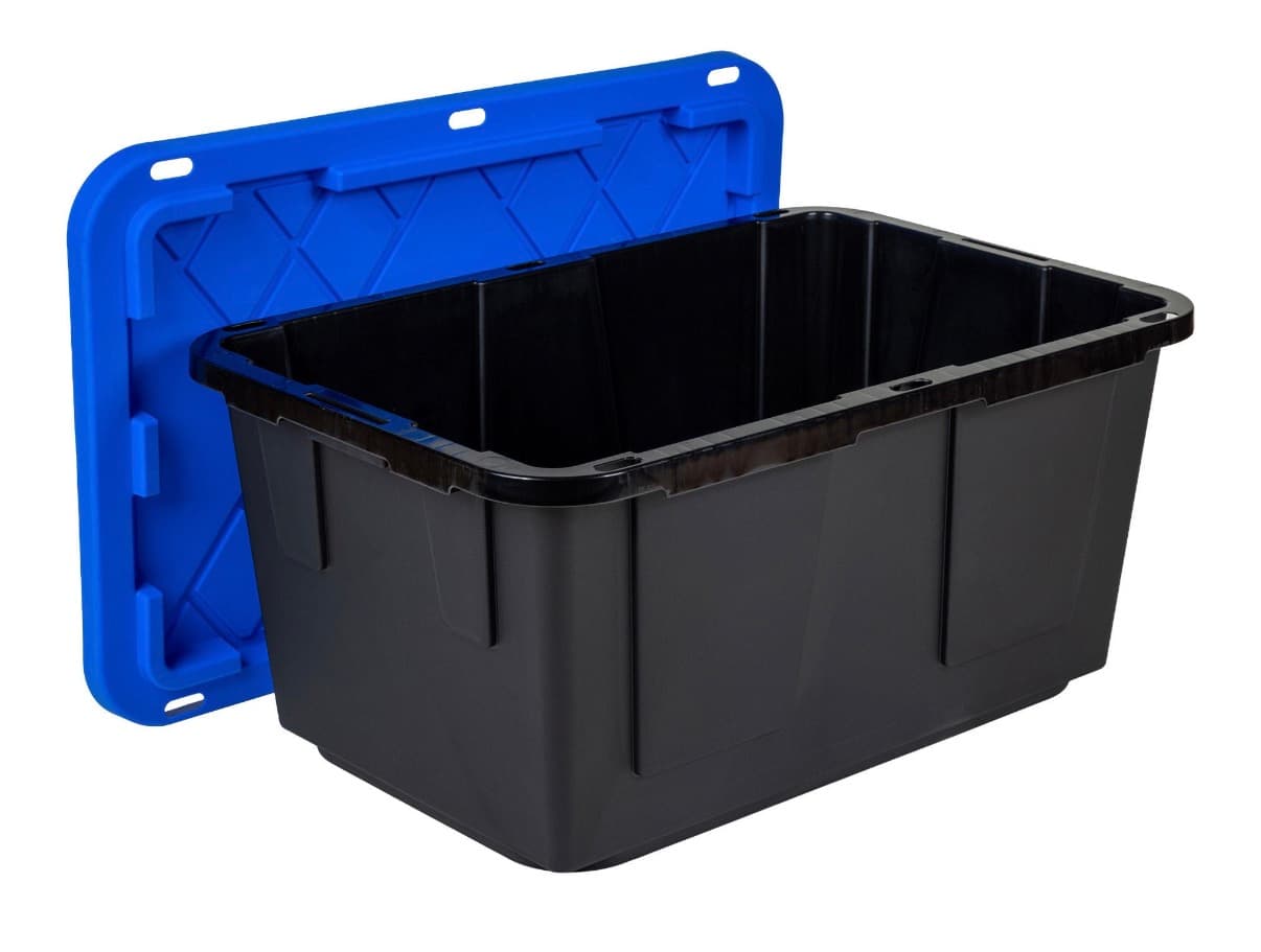 An open black moving tote with its royal blue lid standing behind it, showing the empty interior